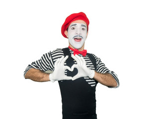 Fototapeta na wymiar Man in striped sweater, white gloves showing love sign by hands. Clown, artist , mime.Isolated on white background