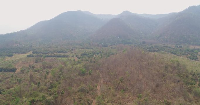 Thung Pi Thailand Aerial v1 Flying around rural landscape near meditation sites - March 2018