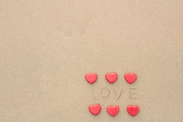 Chocolate color Lovely red heart on the beach. Background is a natural in real place, creative Valentine's Day Concept, tropical style background made in Phuket, Thailand.