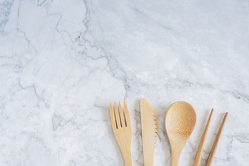 Bamboo wood toothbrush on clean white marble table top view background concept for save the earth day, world environmental, plastic free, kitchen flat lay lifestyle, bathroom reusable wood product.