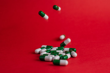 pills in red background