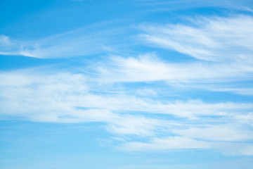 White clouds high in the sky at windy winter day background