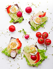 Dietary sandwiches. Dark bread, salads, eggs, cheese and tomatoes