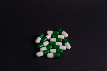 pills in black background