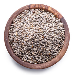 Chia seeds in wooden bowl isolated on white background. File contains clipping path.