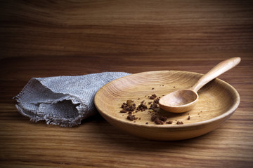 Fasting, Lent. Plate with spoon and crumb on wooden background