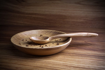 Fasting, Lent. Plate with spoon and crumb on wooden background