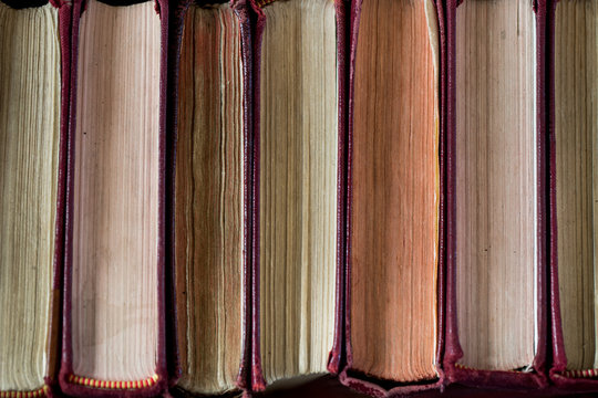 Old vintage stack of books education concept background