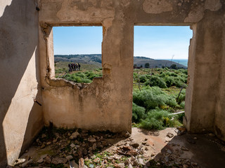 abandoned building with hikers that can be glimpse from the window. Alta Murgia National Park,...
