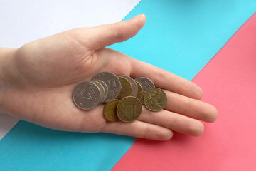 Beggarly salary in Russia, depreciated retirement savings, coins in the hands of women against the...