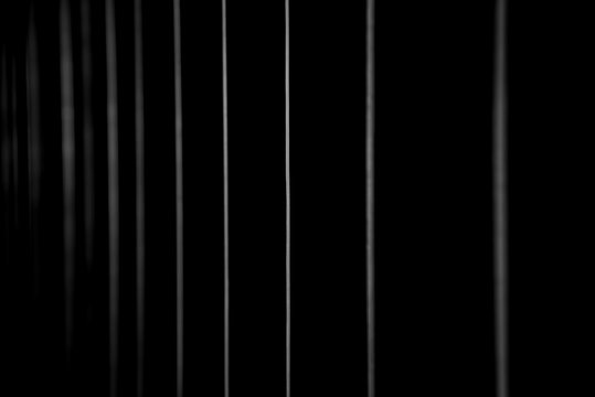 Abstraction of a vertical line on a black background.