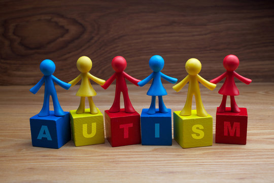 Doll children background design with autism word on cubes