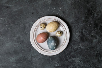 Spring easter minimal background rustic style composition - organic naturally dyed easter eggs
