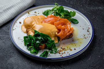 eggs Benedict with salmon and spinach