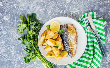baked fish mackerel and potatoes. Selective focus.