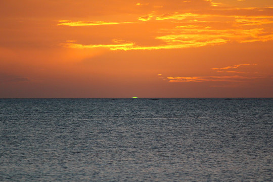 Sunset (Green flash) in the Blue Lagoon Beach in Nacula Island, Yasawa, Fiji