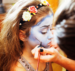 little cute child making facepaint on birthday party, zombie Apocalipse lifestyle people concept
