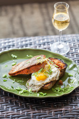 Salmon and fried egg on bread