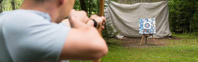 archery in the woods on the target rear view, long photo