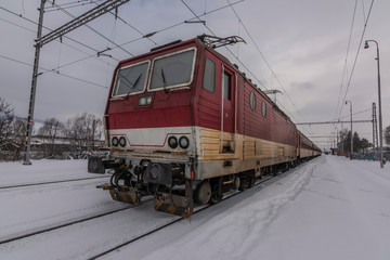 Lipany station in winter snow morning with trains and platforms - obrazy, fototapety, plakaty