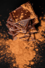 dark chocolate stack and cocoa powder