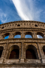 Obraz premium Golden sunset at the Great Roman Colosseum (Coliseum, Colosseo), also known as the Flavian Amphitheatre. Famous world landmark. Scenic urban landscape.