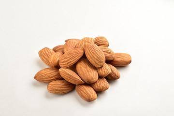 Closeup of almonds, isolated on the white background.