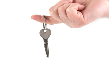 A key from a new house in a finger.