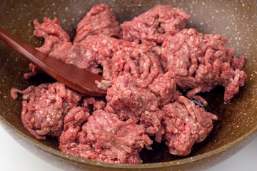 Minced meat on frying pan