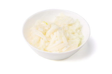 White onion, finely chopped in white plate