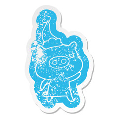 cartoon distressed sticker of a content pig wearing santa hat
