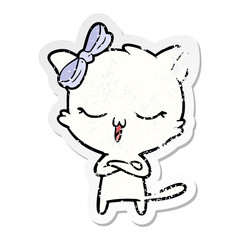 distressed sticker of a cartoon cat with bow on head