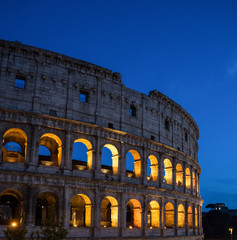 Obraz premium Night at the Great Roman Colosseum (Coliseum, Colosseo), also known as the Flavian Amphitheatre with lights & illumination.