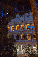 Naklejka premium Night at the Great Roman Colosseum (Coliseum, Colosseo), also known as the Flavian Amphitheatre with lights & illumination.