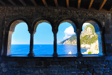 Portovenere (Porto Venere) Italy is the gateway to Cinque Terre and offers amazing views from the arched windows of San Pietro and Doria Castle