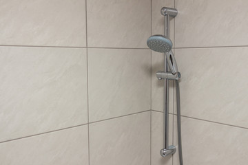 Option of installing a shower in the bathroom, nickel-plated plumbing fixtures on gray ceramic wall...
