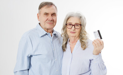 Happy senior family couple with credit card payment isolated on white background. Close up portrait woman and man with wrinkled face. Elderly grandparents people have fun. Smiling mature male, female.