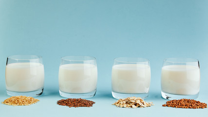 vegetarian milk on a blue background. Vegetable milk from cereals
