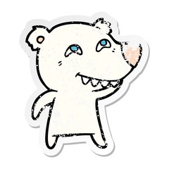 distressed sticker of a cartoon polar bear showing teeth