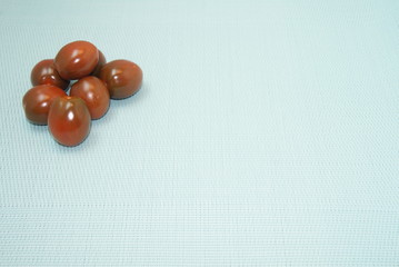   cherry tomatoes are on the table