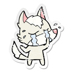 distressed sticker of a cartoon crying wolf