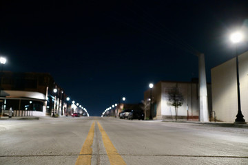 Cityscape view, deserted street scene at night 