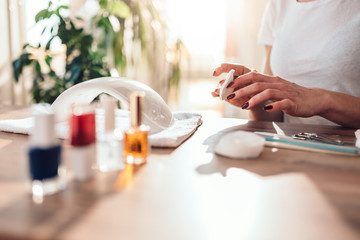 Woman removing nail polish