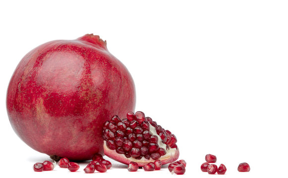 Pomegranate seeds on a white background.