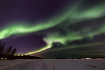 Fotobehang Breathtaking aurora borealis (Northern Lights) in Lapland. The polar Circle, Rovaniemi, Finland. © Viktar