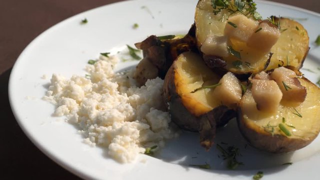 Baking botatoes bnd bacon In The oven with white cheese. 4k