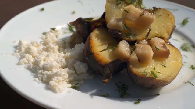 Baking botatoes bnd bacon In The oven with white cheese. 4k