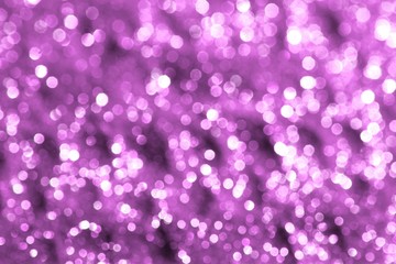 pink bright sand made of brassy glitters with selective focus and small bokeh texture - beautiful abstract photo background