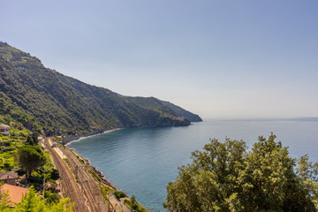 Italy, Cinque Terre, Corniglia, a large body of water with a mountain in the background