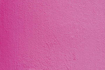 Fototapeta premium Background of a pink stucco coated and painted exterior, rough cast of cement and concrete wall texture